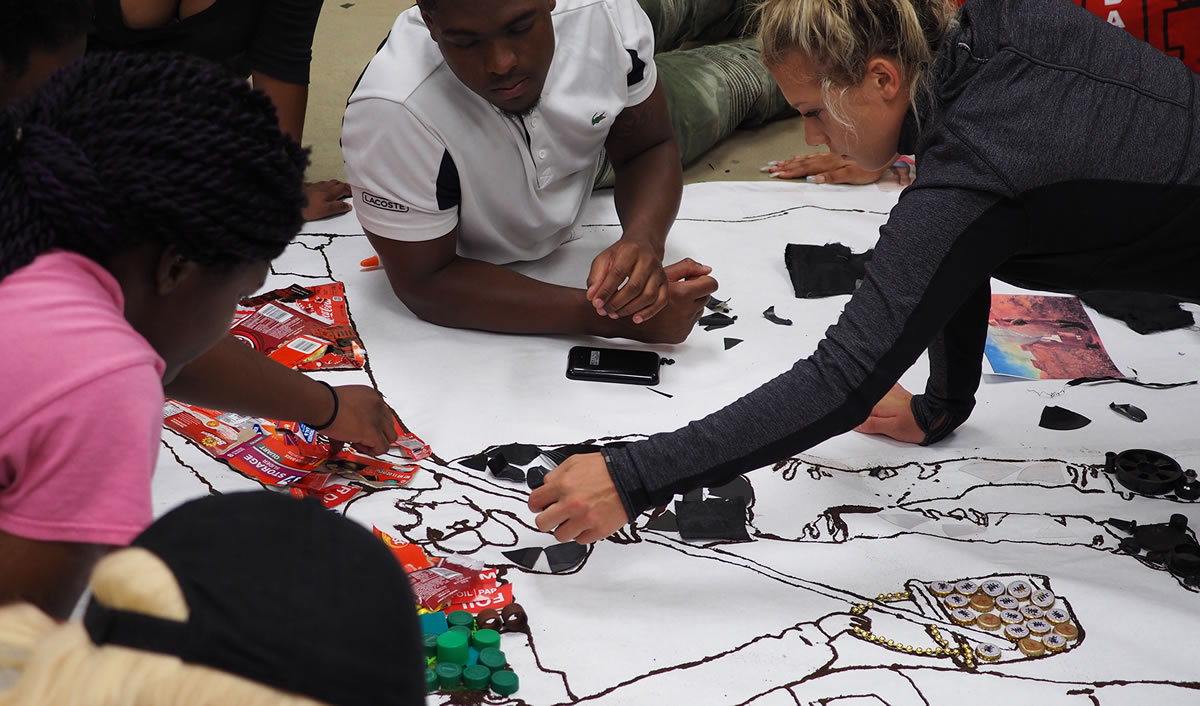 Students working on garbage to art project.